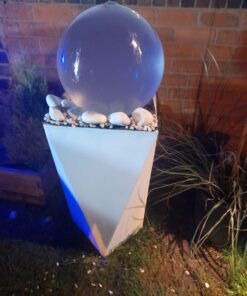 water feature that lights up at night with a fiberglass base called the essense 1