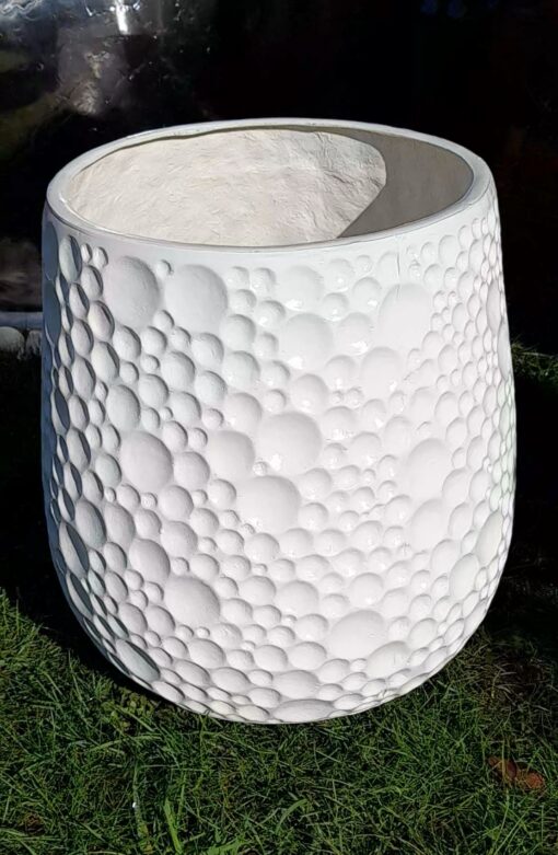 close up of the moon fiberglass planter in garden