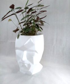 large white head fiberglass planter with plant on top